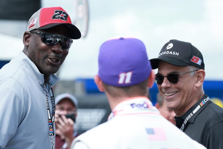 LONG POND, PENNSYLVANIA - JUNE 26: NBA Hall of Famer Michael Jordan meets with co-owner of 23XI Racing Denny Hamlin, driver of the #11 FedEx Ground Toyota, prior to the NASCAR Cup Series Pocono Organics CBD 325 at Pocono Raceway on June 26, 2021 in Long Pond, Pennsylvania. (Photo by Sean Gardner/23XI Racing/Getty Images)