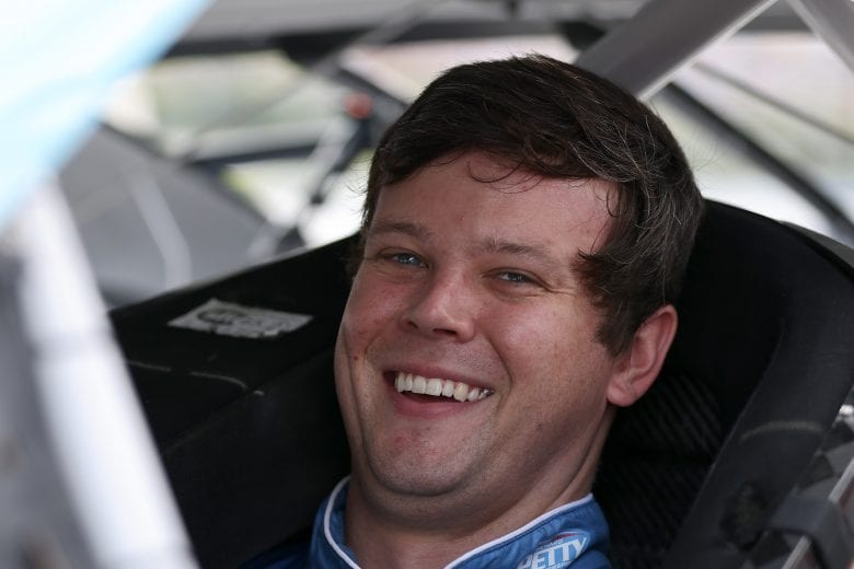 LONG POND, PENNSYLVANIA - JUNE 26: Erik Jones, driver of the #43 Medallion Bank Chevrolet, sits in his car on the grid prior to the NASCAR Cup Series Pocono Organics CBD 325 at Pocono Raceway on June 26, 2021 in Long Pond, Pennsylvania. (Photo by James Gilbert/Getty Images) | Getty Images