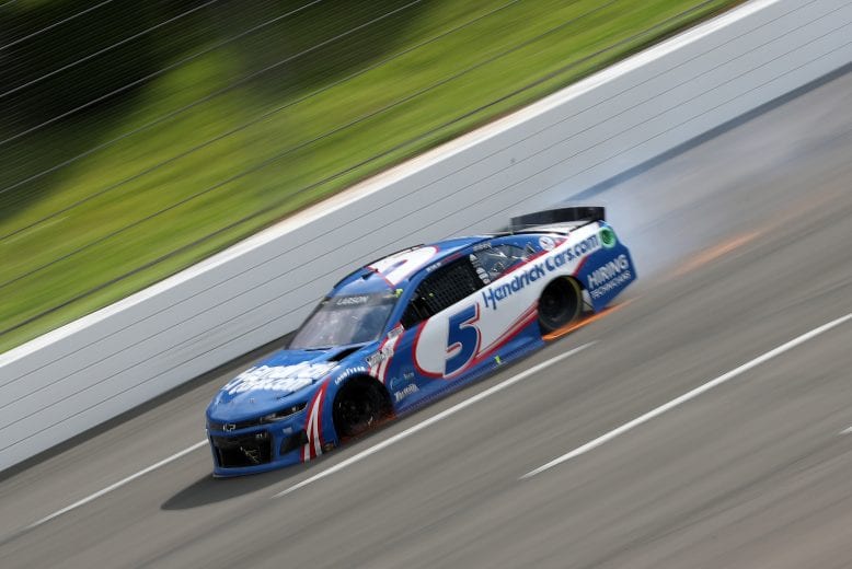 LONG POND, PENNSYLVANIA - JUNE 26: Kyle Larson, driver of the #5 HendrickCars.com Chevrolet, drives with a flat tire on the final turn of the NASCAR Cup Series Pocono Organics CBD 325 at Pocono Raceway on June 26, 2021 in Long Pond, Pennsylvania. (Photo by James Gilbert/Getty Images) | Getty Images