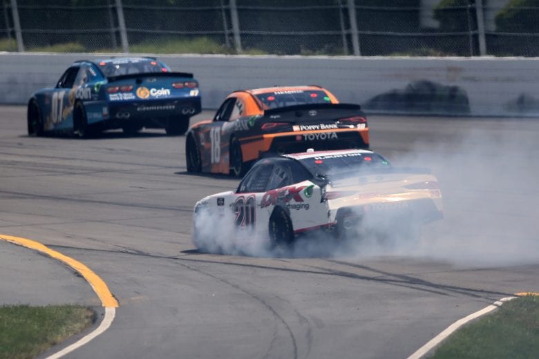 LONG POND, PENNSYLVANIA - JUNE 27: Smoke billows from Harrison Burton, driver of the #20 DEX Imaging Toyota, after an on-track incident during the NASCAR Xfinity Series Pocono Green 225 Recycled by J.P. Mascaro & Sons at Pocono Raceway on June 27, 2021 in Long Pond, Pennsylvania. (Photo by James Gilbert/Getty Images) | Getty Images