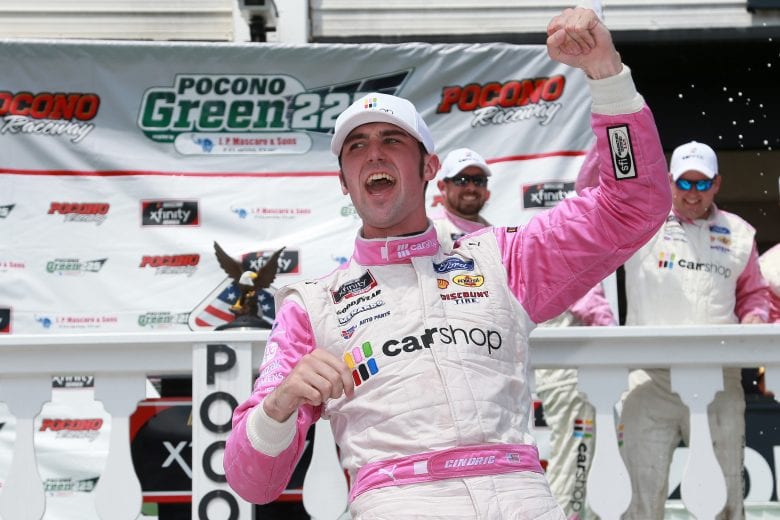LONG POND, PENNSYLVANIA - JUNE 27: Austin Cindric, driver of the #22 Car Shop Ford, celebrates in victory lane after winning the NASCAR Xfinity Series Pocono Green 225 Recycled by J.P. Mascaro & Sons at Pocono Raceway on June 27, 2021 in Long Pond, Pennsylvania. (Photo by Sean Gardner/Getty Images) | Getty Images