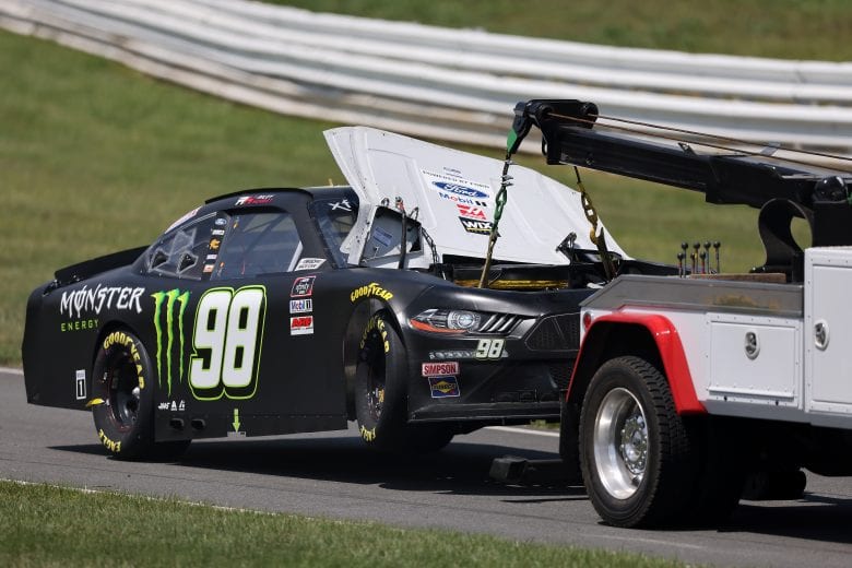 LONG POND, PENNSYLVANIA - JUNE 27: The #98 Monster Energy Ford, driven by Riley Herbst is towed off the track during the NASCAR Xfinity Series Pocono Green 225 Recycled by J.P. Mascaro & Sons at Pocono Raceway on June 27, 2021 in Long Pond, Pennsylvania. (Photo by James Gilbert/Getty Images) | Getty Images