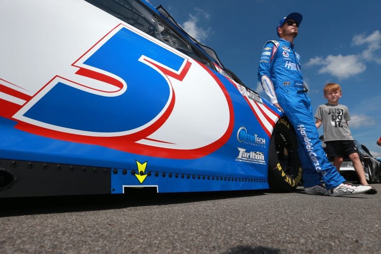 LONG POND, PENNSYLVANIA - JUNE 27: Kyle Larson, driver of the #5 HendrickCars.com Chevrolet, and son Owen wait on the grid prior to the NASCAR Cup Series Explore the Pocono Mountains 350 at Pocono Raceway on June 27, 2021 in Long Pond, Pennsylvania. (Photo by Sean Gardner/Getty Images) | Getty Images