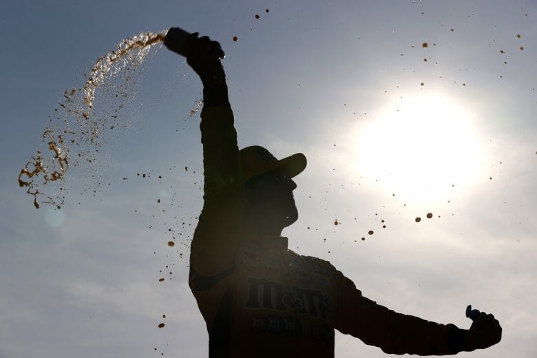 LONG POND, PENNSYLVANIA - JUNE 27: Kyle Busch, driver of the #18 M&M's Mini's Toyota, celebrates in victory lane after winning the NASCAR Xfinity Series Pocono Green 225 Recycled by J.P. Mascaro & Sons at Pocono Raceway on June 27, 2021 in Long Pond, Pennsylvania. (Photo by Tim Nwachukwu/Getty Images) | Getty Images