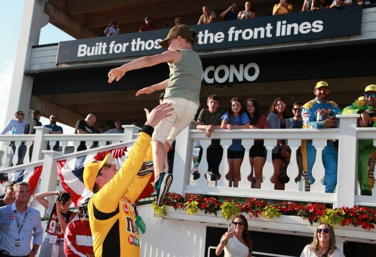LONG POND, PENNSYLVANIA - JUNE 27: Kyle Busch, driver of the #18 M&M's Mini's Toyota, celebrates with his son, Brexton in victory lane after winning the NASCAR Xfinity Series Pocono Green 225 Recycled by J.P. Mascaro & Sons at Pocono Raceway on June 27, 2021 in Long Pond, Pennsylvania. (Photo by Sean Gardner/Getty Images) | Getty Images