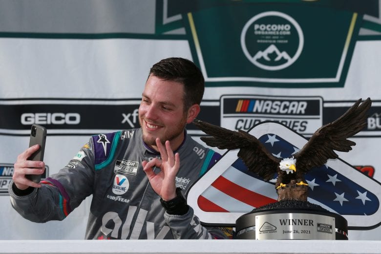 LONG POND, PENNSYLVANIA - JUNE 26: Alex Bowman, driver of the #48 Ally Chevrolet, celebrates with a selfie in victory lane after winning the NASCAR Cup Series Pocono Organics CBD 325 at Pocono Raceway on June 26, 2021 in Long Pond, Pennsylvania. (Photo by Sean Gardner/Getty Images) | Getty Images