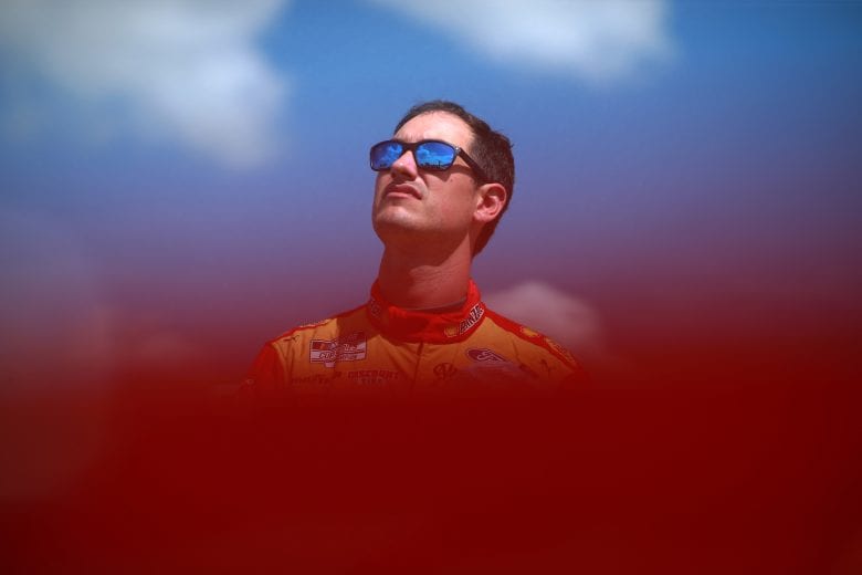 LONG POND, PENNSYLVANIA - JUNE 27: Joey Logano, driver of the #22 Shell Pennzoil Ford, stand on the grid during pre-race ceremonies prior to the NASCAR Cup Series Explore the Pocono Mountains 350 at Pocono Raceway on June 27, 2021 in Long Pond, Pennsylvania. (Photo by Sean Gardner/Getty Images) | Getty Images