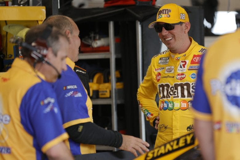 LEBANON, TENNESSEE - JUNE 19: Kyle Busch, driver of the #18 Pedigree Toyota, talks with his crew in the garage area during practice for the NASCAR Cup Series Ally 400 at Nashville Superspeedway on June 19, 2021 in Lebanon, Tennessee. (Photo by Sarah Stier/Getty Images) | Getty Images