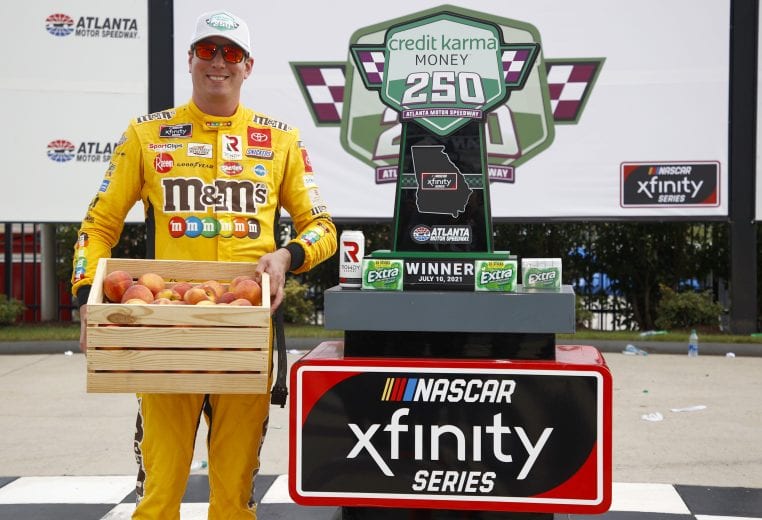 HAMPTON, GEORGIA - JULY 10: Kyle Busch, driver of the #54 Extra Gum Toyota, celebrates in victory lane after winning the NASCAR Xfinity Series Credit Karma Money 250 at Atlanta Motor Speedway on July 10, 2021 in Hampton, Georgia. (Photo by Jared C. Tilton/Getty Images) | Getty Images