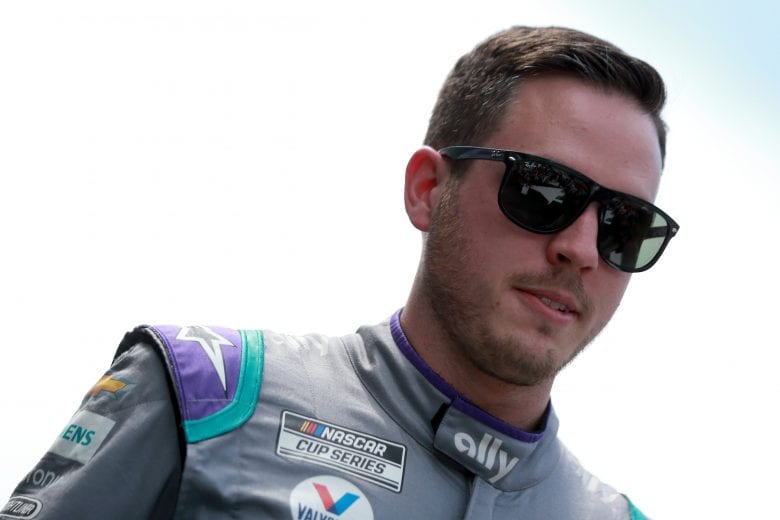 HAMPTON, GEORGIA - JULY 11: Alex Bowman, driver of the #48 Ally Chevrolet, walks the stage during pre-race ceremonies prior to the NASCAR Cup Series Quaker State 400 presented by Walmart at Atlanta Motor Speedway on July 11, 2021 in Hampton, Georgia. (Photo by Sean Gardner/Getty Images) | Getty Images