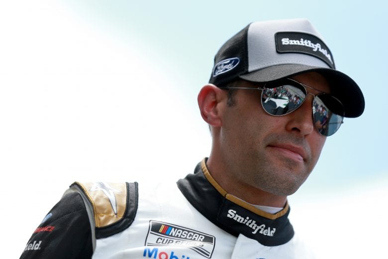 HAMPTON, GEORGIA - JULY 11: Aric Almirola, driver of the #10 Smithfield Ford, walks the stage during pre-race ceremonies prior to the NASCAR Cup Series Quaker State 400 presented by Walmart at Atlanta Motor Speedway on July 11, 2021 in Hampton, Georgia. (Photo by Sean Gardner/Getty Images) | Getty Images