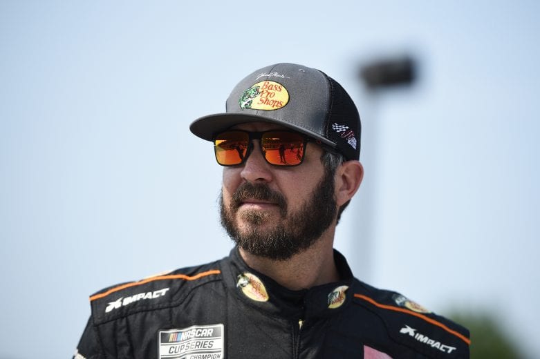 ELKHART LAKE, WISCONSIN - JULY 04: Martin Truex Jr., driver of the #19 Bass Pro Toyota, walks the grid during qualifying for the NASCAR Cup Series Jockey Made in America 250 Presented by Kwik Trip at Road America on July 04, 2021 in Elkhart Lake, Wisconsin. (Photo by Logan Riely/Getty Images) | Getty Images