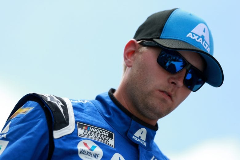 HAMPTON, GEORGIA - JULY 11: William Byron, driver of the #24 Axalta Chevrolet, walks the stage during pre-race ceremonies prior to the NASCAR Cup Series Quaker State 400 presented by Walmart at Atlanta Motor Speedway on July 11, 2021 in Hampton, Georgia. (Photo by Sean Gardner/Getty Images) | Getty Images