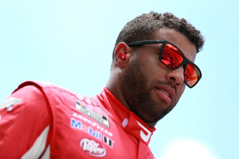 HAMPTON, GEORGIA - JULY 11: Bubba Wallace, driver of the #23 Door Dash Toyota, walks the stage during pre-race ceremonies prior to the NASCAR Cup Series Quaker State 400 presented by Walmart at Atlanta Motor Speedway on July 11, 2021 in Hampton, Georgia. (Photo by Sean Gardner/Getty Images) | Getty Images