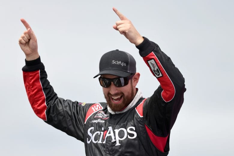 LOUDON, NEW HAMPSHIRE - JULY 17: CJ McLaughlin, driver of the #61 Sci Aps Toyota, walks on stage during pre-race ceremonies prior to the NASCAR Xfinity Series Ambetter Get Vaccinated 200 at New Hampshire Motor Speedway on July 17, 2021 in Loudon, New Hampshire. (Photo by James Gilbert/Getty Images) | Getty Images