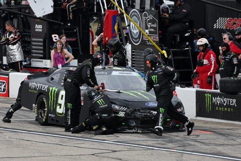 LOUDON, NEW HAMPSHIRE - JULY 17: The pit crew of Riley Herbst, driver of the #98 Monster Energy Ford, work to repair a damaged car during the NASCAR Xfinity Series Ambetter Get Vaccinated 200 at New Hampshire Motor Speedway on July 17, 2021 in Loudon, New Hampshire. (Photo by James Gilbert/Getty Images) | Getty Images