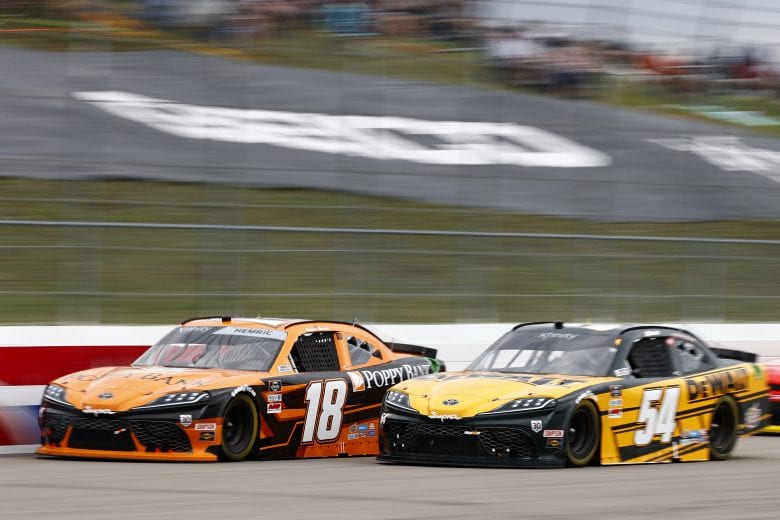 LOUDON, NEW HAMPSHIRE - JULY 17: Daniel Hemric, driver of the #18 Poppy Bank Toyota, and Christopher Bell, driver of the #54 DEWALT Toyota, race during the NASCAR Xfinity Series Ambetter Get Vaccinated 200 at New Hampshire Motor Speedway on July 17, 2021 in Loudon, New Hampshire. (Photo by Jared C. Tilton/Getty Images) | Getty Images