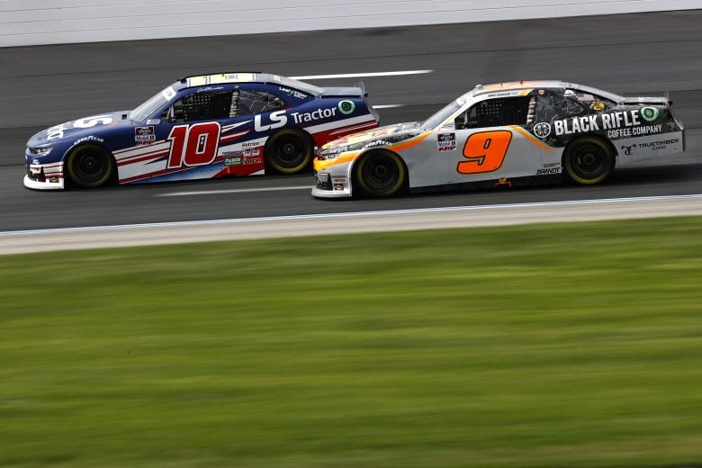 LOUDON, NEW HAMPSHIRE - JULY 17: Jeb Burton, driver of the #10 LS Tractors Chevrolet, and Noah Gragson, driver of the #9 Bass Pro Shops/TrueTimber/BRCC Chevrolet, race during the NASCAR Xfinity Series Ambetter Get Vaccinated 200 at New Hampshire Motor Speedway on July 17, 2021 in Loudon, New Hampshire. (Photo by Jared C. Tilton/Getty Images) | Getty Images