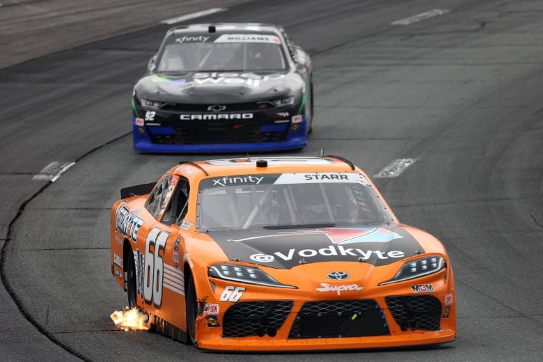 LOUDON, NEW HAMPSHIRE - JULY 17: Flames are seen from David Starr, driver of the #66 Vodkyte Toyota, as he drives during the NASCAR Xfinity Series Ambetter Get Vaccinated 200 at New Hampshire Motor Speedway on July 17, 2021 in Loudon, New Hampshire. (Photo by James Gilbert/Getty Images) | Getty Images