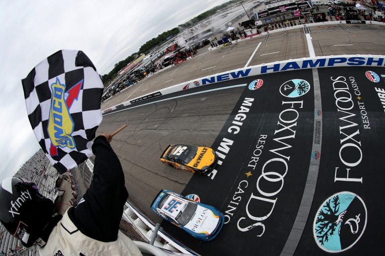 LOUDON, NEW HAMPSHIRE - JULY 17: Christopher Bell, driver of the #54 DEWALT Toyota, takes the checkered flag to win the NASCAR Xfinity Series Ambetter Get Vaccinated 200 at New Hampshire Motor Speedway on July 17, 2021 in Loudon, New Hampshire. (Photo by James Gilbert/Getty Images) | Getty Images