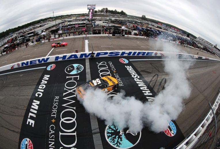 LOUDON, NEW HAMPSHIRE - JULY 17: Christopher Bell, driver of the #54 DEWALT Toyota,celebrates with a burnout after winning the NASCAR Xfinity Series Ambetter Get Vaccinated 200 at New Hampshire Motor Speedway on July 17, 2021 in Loudon, New Hampshire. (Photo by James Gilbert/Getty Images) | Getty Images