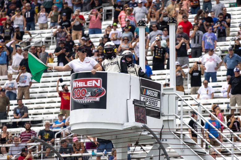 Laura Hecker, Whelen Engineering - Director of Corporate
Program Management wavs the green flag during the Whelen 100 for the NASCAR Whelen Modified Series at New Hampshire Motor Speedway in Loudon, New Hampshire on July 17, 2021. (Paul Rutherford/NASCAR)