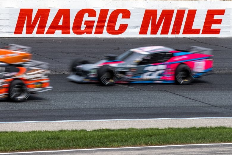 Kyle Bonsignore, driver of the #22 Chateau Performance/Mumms Auto/Wilwood Brakes Chevrolet, drives by the Magic Mile sign during the Whelen 100 for the NASCAR Whelen Modified Series at New Hampshire Motor Speedway in Loudon, New Hampshire on July 17, 2021. (Paul Rutherford/NASCAR)