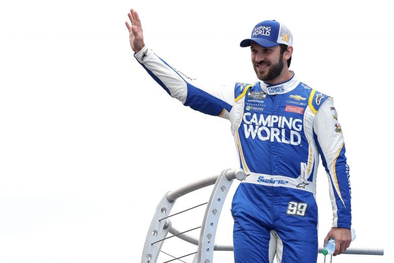 LOUDON, NEW HAMPSHIRE - JULY 18: Daniel Suarez, driver of the #99 Good Sam Chevrolet, waves to fans on stage during pre-race ceremonies prior to the NASCAR Cup Series Foxwoods Resort Casino 301 at New Hampshire Motor Speedway on July 18, 2021 in Loudon, New Hampshire. (Photo by James Gilbert/Getty Images) | Getty Images