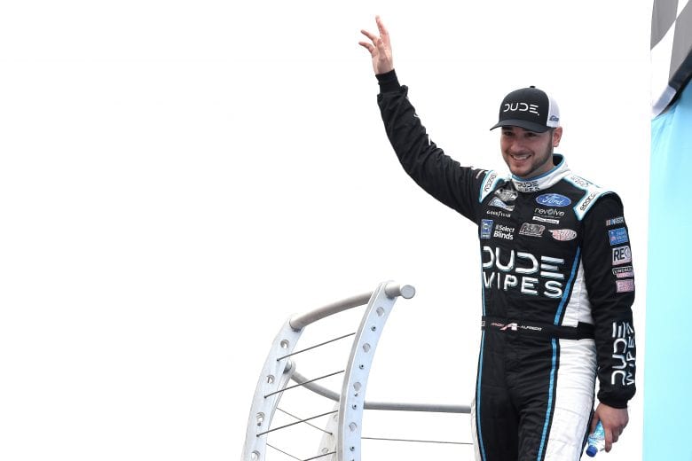 LOUDON, NEW HAMPSHIRE - JULY 18: Anthony Alfredo, driver of the #38 Dude Wipes Ford, waves to fans on stage during pre-race ceremonies prior to the NASCAR Cup Series Foxwoods Resort Casino 301 at New Hampshire Motor Speedway on July 18, 2021 in Loudon, New Hampshire. (Photo by James Gilbert/Getty Images) | Getty Images