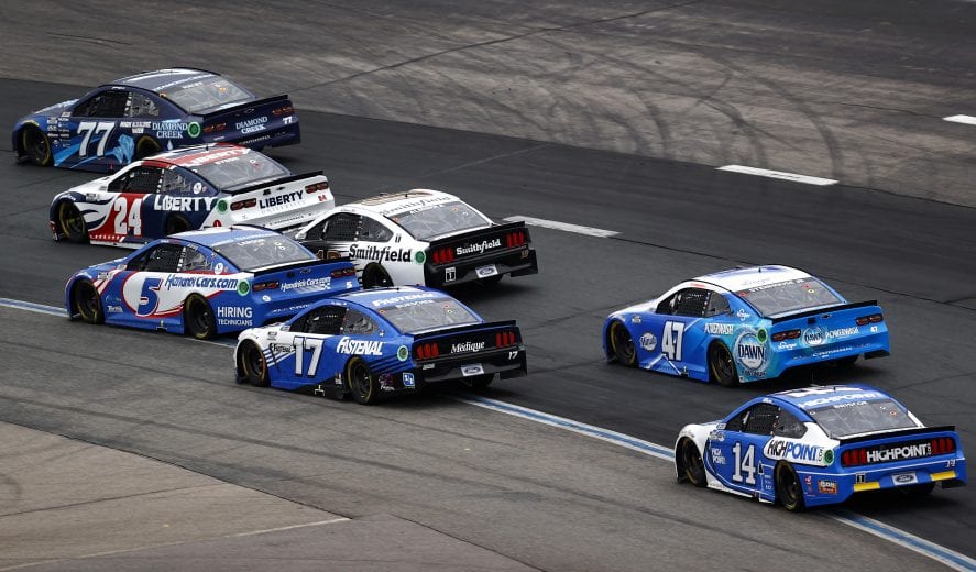 LOUDON, NEW HAMPSHIRE - JULY 18: Justin Haley, driver of the #77 Diamond Creek Water Chevrolet, William Byron, driver of the #24 Liberty University Chevrolet, Kyle Larson, driver of the #5 HendrickCars.com Chevrolet, Chris Buescher, driver of the #17 Fastenal Ford, Ricky Stenhouse Jr., driver of the #47 Kroger/Dawn Chevrolet, and Chase Briscoe, driver of the #14 Ford, race during the NASCAR Cup Series Foxwoods Resort Casino 301 at New Hampshire Motor Speedway on July 18, 2021 in Loudon, New Hampshire. (Photo by Jared C. Tilton/Getty Images) | Getty Images