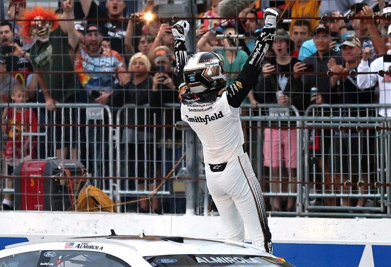 LOUDON, NEW HAMPSHIRE - JULY 18: Aric Almirola, driver of the #10 Smithfield Ford, celebrates after winning the NASCAR Cup Series Foxwoods Resort Casino 301 at New Hampshire Motor Speedway on July 18, 2021 in Loudon, New Hampshire. (Photo by James Gilbert/Getty Images) | Getty Images