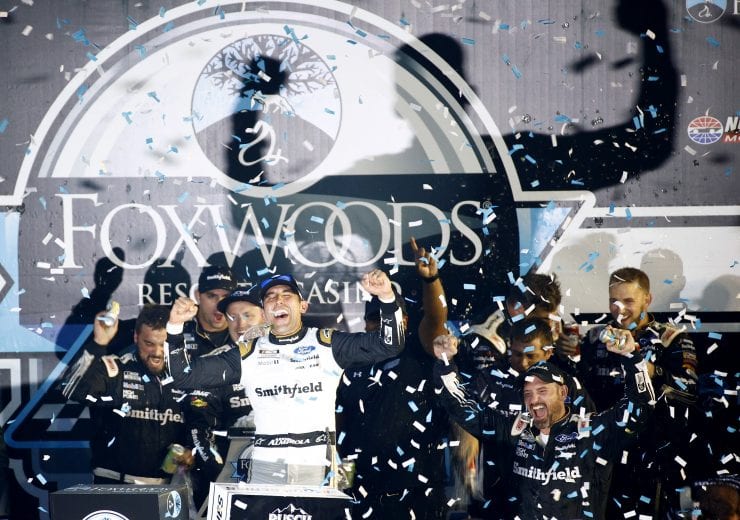 LOUDON, NEW HAMPSHIRE - JULY 18: Aric Almirola, driver of the #10 Smithfield Ford, celebrates in victory lane after winning the NASCAR Cup Series Foxwoods Resort Casino 301 at New Hampshire Motor Speedway on July 18, 2021 in Loudon, New Hampshire. (Photo by Jared C. Tilton/Getty Images) | Getty Images