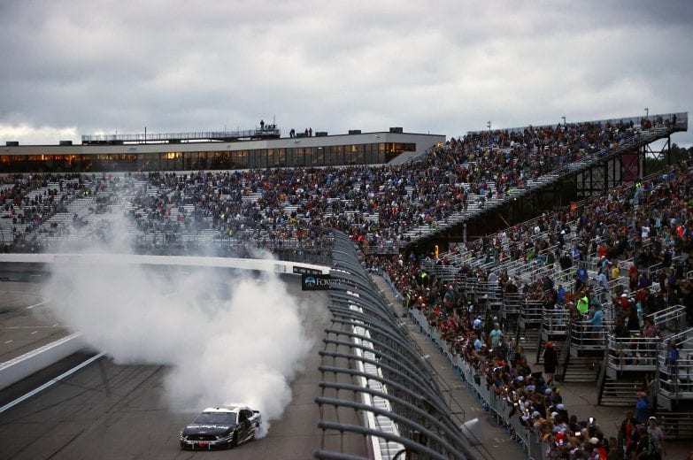 LOUDON, NEW HAMPSHIRE - JULY 18: Aric Almirola, driver of the #10 Smithfield Ford, celebrates with a burnout after winning the NASCAR Cup Series Foxwoods Resort Casino 301 at New Hampshire Motor Speedway on July 18, 2021 in Loudon, New Hampshire. (Photo by Jared C. Tilton/Getty Images) | Getty Images