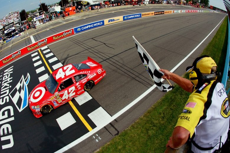 WATKINS GLEN, NY - AUGUST 08:  Juan Pablo Montoya, driver of the #42 Target Chevrolet, crosses the finish line to win the NASCAR Sprint Cup Series Heluva Good! Sour Cream Dips at Watkins Glen International on August 8, 2010 in Watkins Glen, New York.  (Photo by Kevin C. Cox/Getty Images) | Getty Images