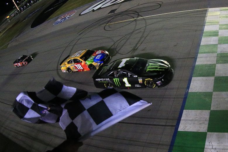SPARTA, KENTUCKY - JULY 13: Kurt Busch, driver of the #1 Monster Energy Chevrolet, takes the checkered flag ahead of Kyle Busch, driver of the #18 M&M's Toyota Camry Toyota, to win the Monster Energy NASCAR Cup Series Quaker State 400 Presented by Walmart at Kentucky Speedway on July 13, 2019 in Sparta, Kentucky. (Photo by Daniel Shirey/Getty Images)
