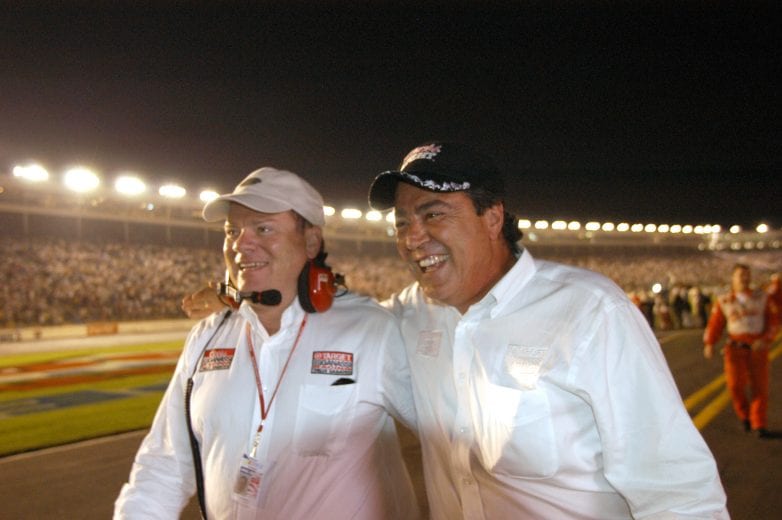 CONCORD, NC - OCTOBER 13:  Chip Ganassi and Felix Sabates, owners of Ganassi Racing, walk to victory lane after driver Jamie McMurray's #40 Ganassi Racing Dodge R/T won the UAW-GM Quality 500, part of the NASCAR Winston Cup Series, at Lowe's Motor Speedway in Concord, North Carolina on October 13, 2002.  (Photo By Rusty Jarrett /Getty Images) | Getty Images