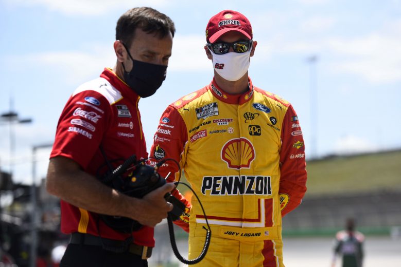 SPARTA, KENTUCKY - JULY 12: Joey Logano, driver of the #22 Shell Pennzoil Ford, and crew chief Paul Wolfe talk on the grid prior to the NASCAR Cup Series Quaker State 400 Presented by Walmart at Kentucky Speedway on July 12, 2020 in Sparta, Kentucky. (Photo by Jared C. Tilton/Getty Images) | Getty Images