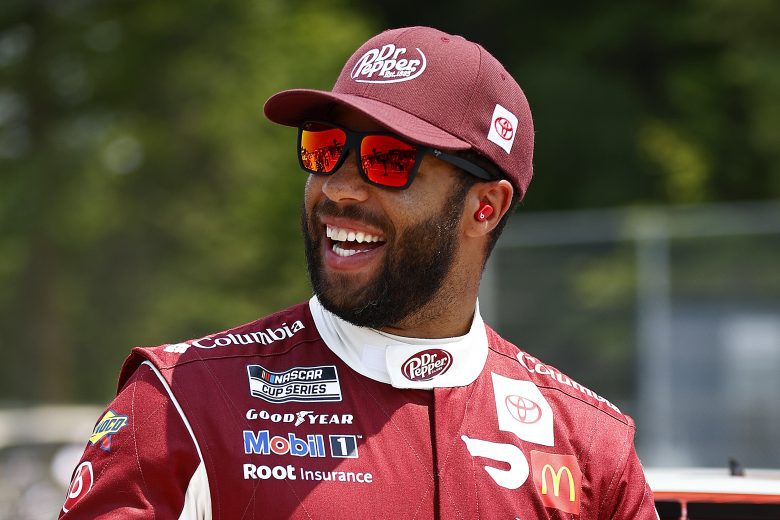 ELKHART LAKE, WISCONSIN - JULY 04: Bubba Wallace, driver of the #23 Dr. Pepper Toyota, laughs as he walks the grid prior to the NASCAR Cup Series Jockey Made in America 250 Presented by Kwik Trip at Road America on July 04, 2021 in Elkhart Lake, Wisconsin. (Photo by Jared C. Tilton/23XI Racing via Getty Images)