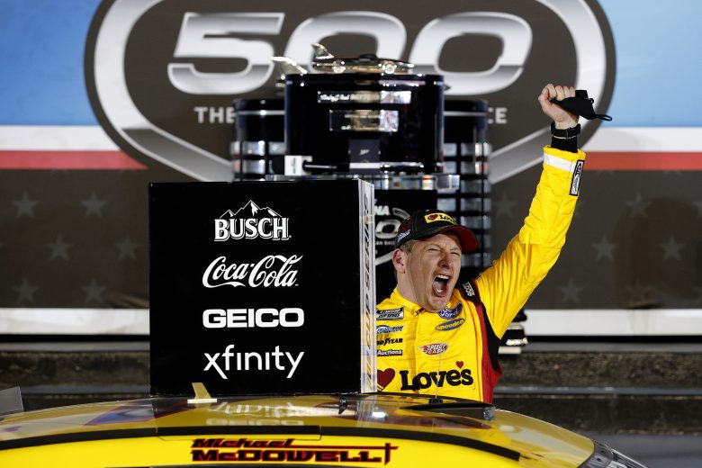DAYTONA BEACH, FLORIDA - FEBRUARY 14: Michael McDowell, driver of the #34 Love's Travel Stops Ford, celebrates in victory lane after winning the NASCAR Cup Series 63rd Annual Daytona 500 at Daytona International Speedway on February 14, 2021 in Daytona Beach, Florida. (Photo by Chris Graythen/Getty Images) | Getty Images