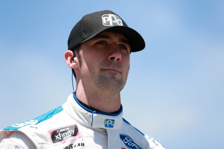 LEXINGTON, OHIO - JUNE 05: Austin Cindric, driver of the #22 PPG Ford, walks the grid prior to the NASCAR Xfinity Series B&L Transport 170 at Mid-Ohio Sports Car Course on June 05, 2021 in Lexington, Ohio. (Photo by Sean Gardner/Getty Images) | Getty Images