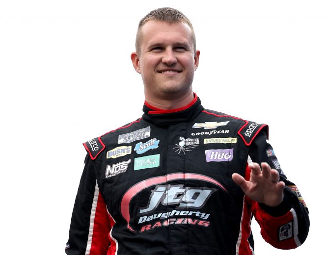LOUDON, NEW HAMPSHIRE - JULY 18: Ryan Preece, driver of the #37 Healthy Choice Power Bowls Chevrolet, waves to fans on stage during pre-race ceremonies prior to the NASCAR Cup Series Foxwoods Resort Casino 301 at New Hampshire Motor Speedway on July 18, 2021 in Loudon, New Hampshire. (Photo by James Gilbert/Getty Images) | Getty Images