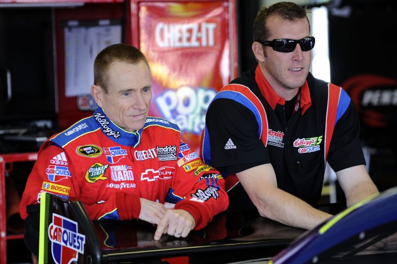 LONG POND, PA - AUGUST 01: Mark Martin (L), driver of the #5 Cheez-It/CARQUEST Chevrolet, stands with his crew chief Alan Gustafson during practice for the NASCAR Sprint Cup Series Sunoco Red Cross Pennsylvania 500 at the Pocono Raceway on August 1, 2009 in Long Pond, Pennsylvania. (Photo by John Harrelson/Getty Images for NASCAR) | Getty Images