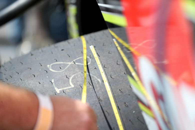 A crew member of Eric Goodale, driver of the #58 GAF Roofing Chevrolet, measures a tire prior to the Nu Way Auto Parts 150 for the NASCAR Whelen Modified Tour at New York International Raceway Park in Lancaster, New York on July 31, 2021. (Bryan Bennett/NASCAR)