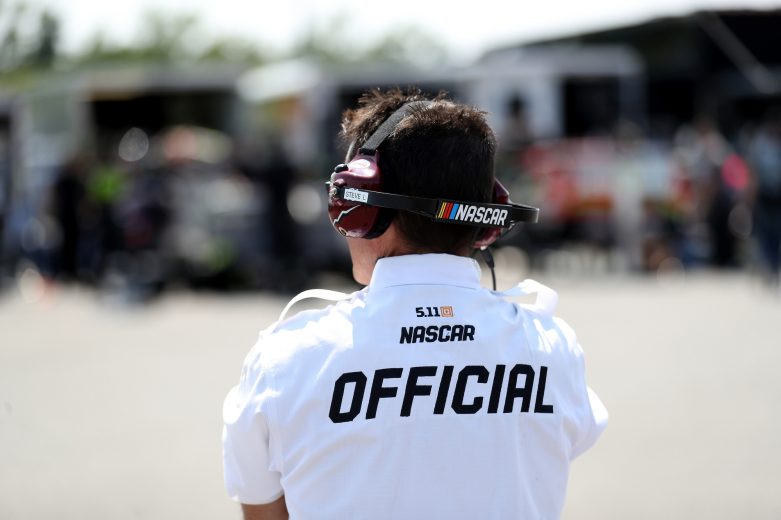A Nascar official looks on during practice for the Nu Way Auto Parts 150 for the NASCAR Whelen Modified Tour at New York International Raceway Park in Lancaster, New York on July 31, 2021. (Bryan Bennett/NASCAR)