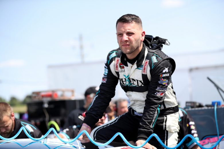 Justin Bonsignore, driver of the #51 Phoenix Communications, Inc. Chevrolet, gets out of his car after practice prior to the Nu Way Auto Parts 150 for the NASCAR Whelen Modified Tour at New York International Raceway Park in Lancaster, New York on July 31, 2021. (Bryan Bennett/NASCAR)