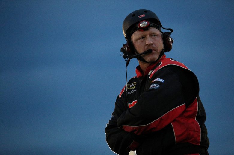 A crew member of Jonathan McKennedy, driver of the #7 Ultra Wheel Troyer, watches during the Nu Way Auto Parts 150 for the NASCAR Whelen Modified Tour at New York International Raceway Park in Lancaster, New York on July 31, 2021. (Bryan Bennett/NASCAR)