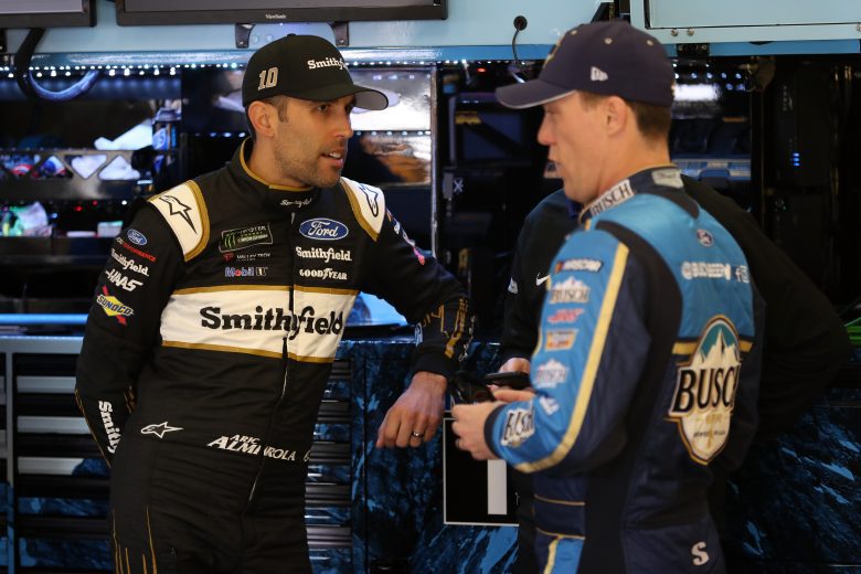 HAMPTON, GA - FEBRUARY 22: Aric Almirola, driver of the #10 Smithfield Ford, talks with Kevin Harvick, driver of the #4 Busch Beer Ford, during practice for the Monster Energy NASCAR Cup Series Folds of Honor Quiktrip 500 at Atlanta Motor Speedway on February 22, 2019 in Hampton, Georgia. (Photo by Chris Graythen/Getty Images) | Getty Images