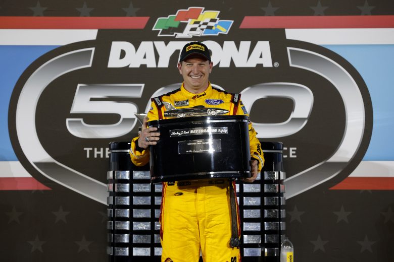 DAYTONA BEACH, FLORIDA - FEBRUARY 14: Michael McDowell, driver of the #34 Love's Travel Stops Ford, celebrates in victory lane after winning the NASCAR Cup Series 63rd Annual Daytona 500 at Daytona International Speedway on February 14, 2021 in Daytona Beach, Florida. (Photo by Chris Graythen/Getty Images) | Getty Images