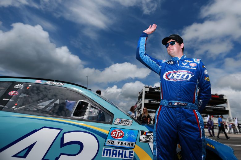 LONG POND, PENNSYLVANIA - JUNE 26: Erik Jones, driver of the #43 Medallion Bank Chevrolet, waves to fans on the grid prior to the NASCAR Cup Series Pocono Organics CBD 325 at Pocono Raceway on June 26, 2021 in Long Pond, Pennsylvania. (Photo by Sean Gardner/Getty Images) | Getty Images