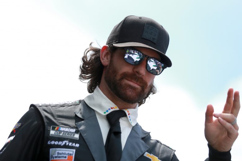 HAMPTON, GEORGIA - JULY 11: Corey LaJoie, driver of the #7 The Boss Baby: Family Business Chevrolet, walks the stage during pre-race ceremonies prior to the NASCAR Cup Series Quaker State 400 presented by Walmart at Atlanta Motor Speedway on July 11, 2021 in Hampton, Georgia. (Photo by Sean Gardner/Getty Images) | Getty Images